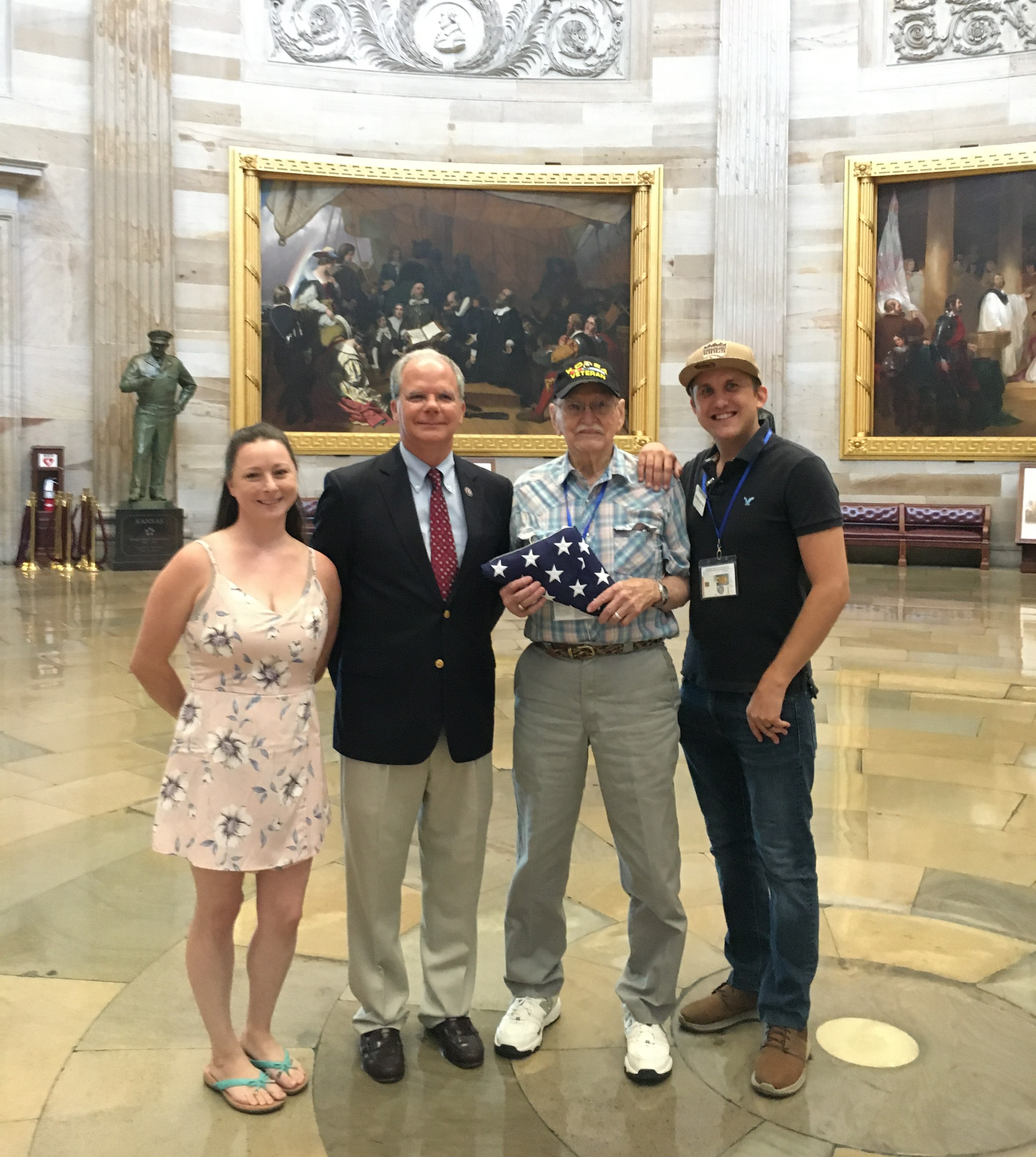 Guthrie presenting a flag in the U.S. Capitol to Korean War veteran Glenn Harrison