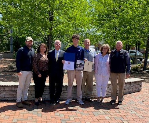 Rep. Guthrie presenting Parker Greer with a certificate for USNA appointment